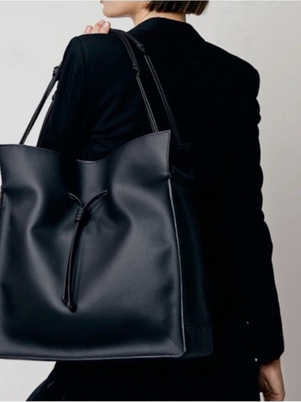 Elegant Black Leather Tote with Drawstring Detail